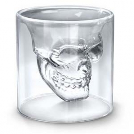 Petit verre avec une forme interne de crâne. 
Vous pouvez utiliser ce verre dans les deux sens.
